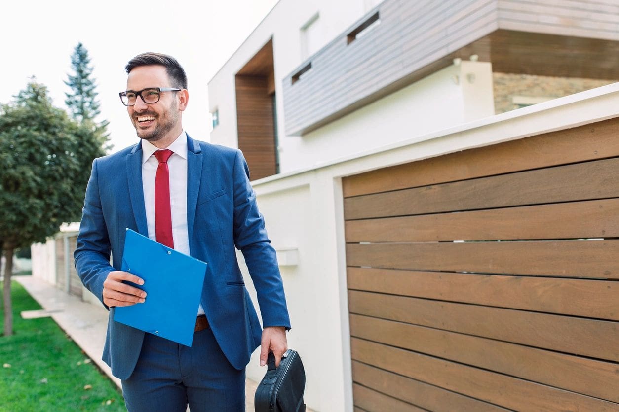 Businessman walking with briefcase and folder