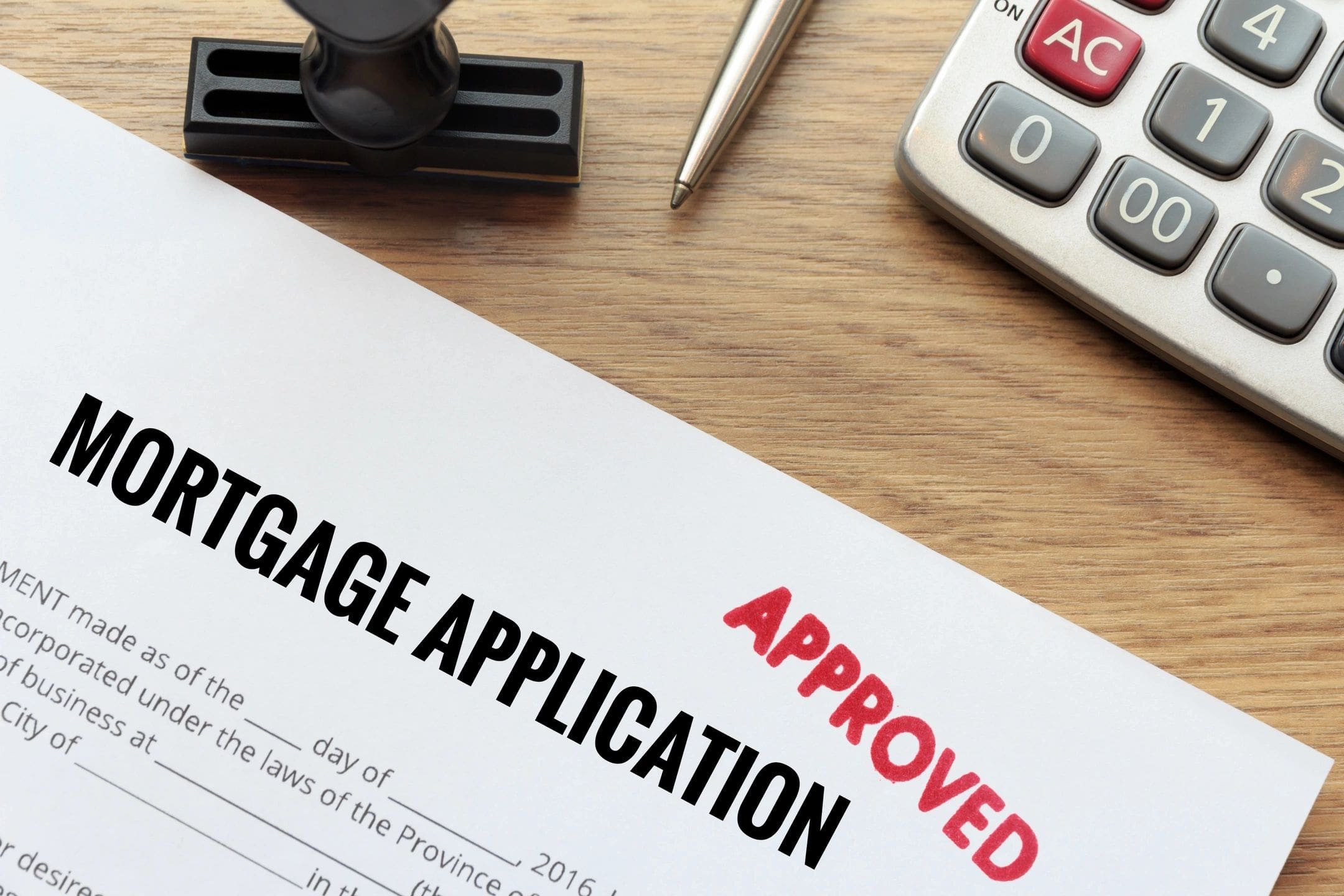 Approved mortgage application form on desk