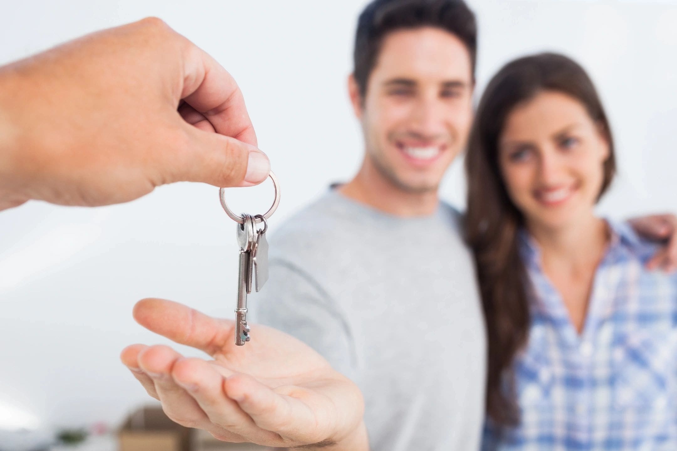 Happy couple getting house keys