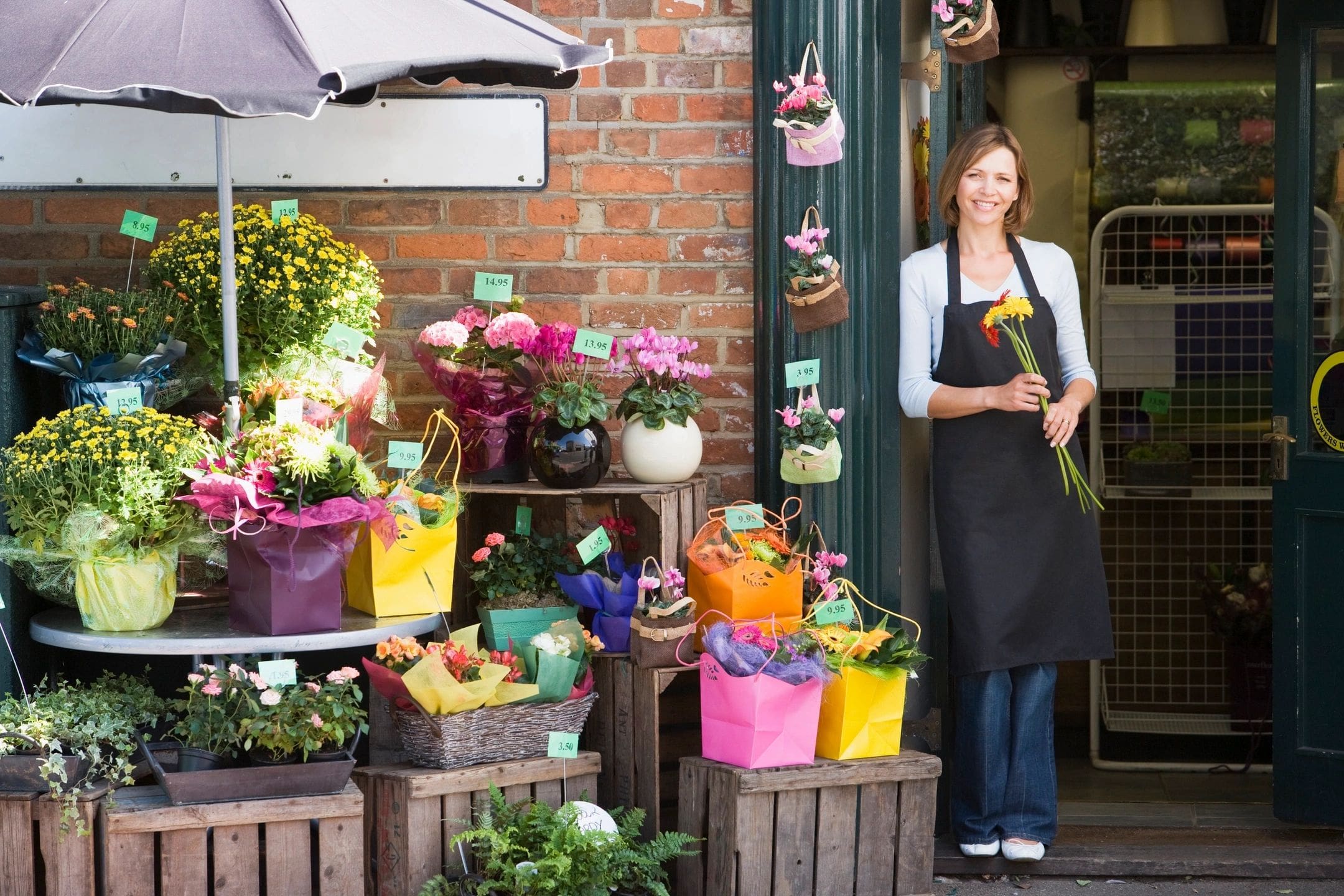 Flower shop display with smiling florist