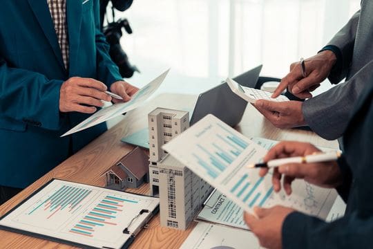 Team discussing financial documents at table