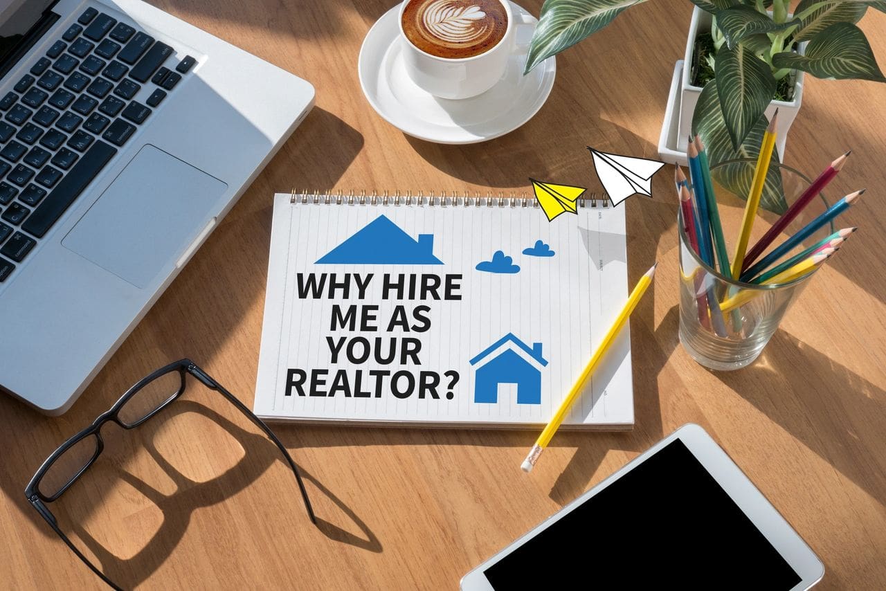 Note asking why to hire the person as a realtor on a desk with coffee and glasses.